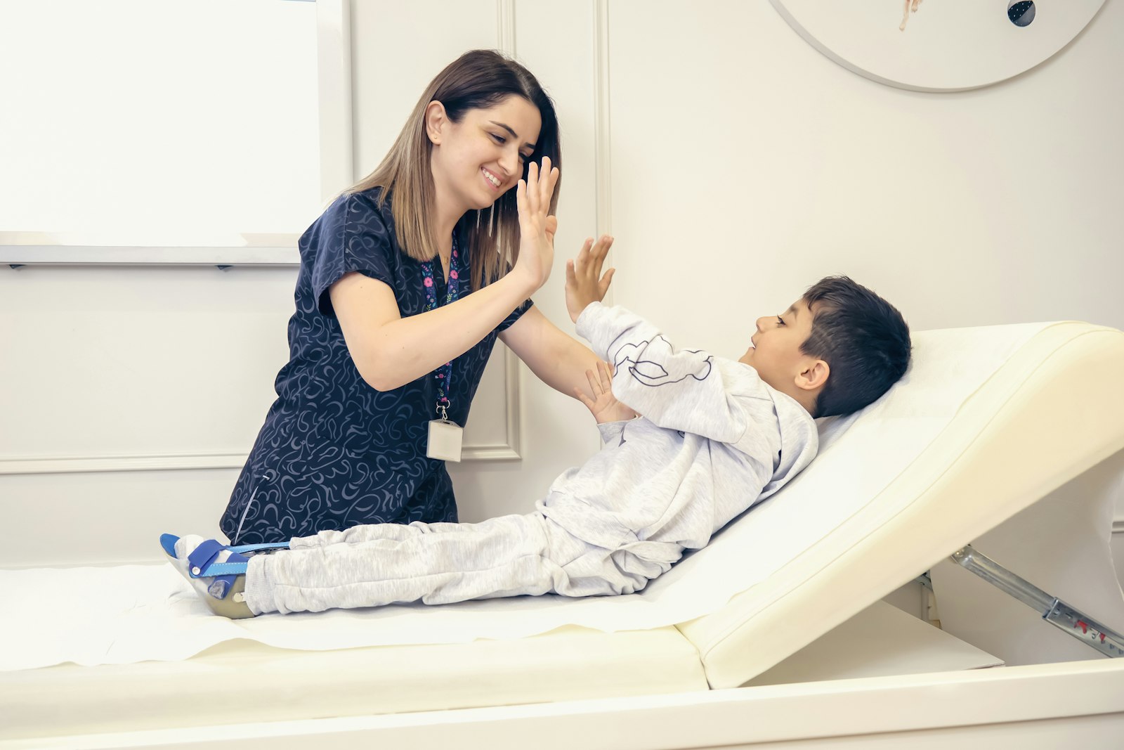 Child giving a high five during occupational therapy in The Woodlands, TX