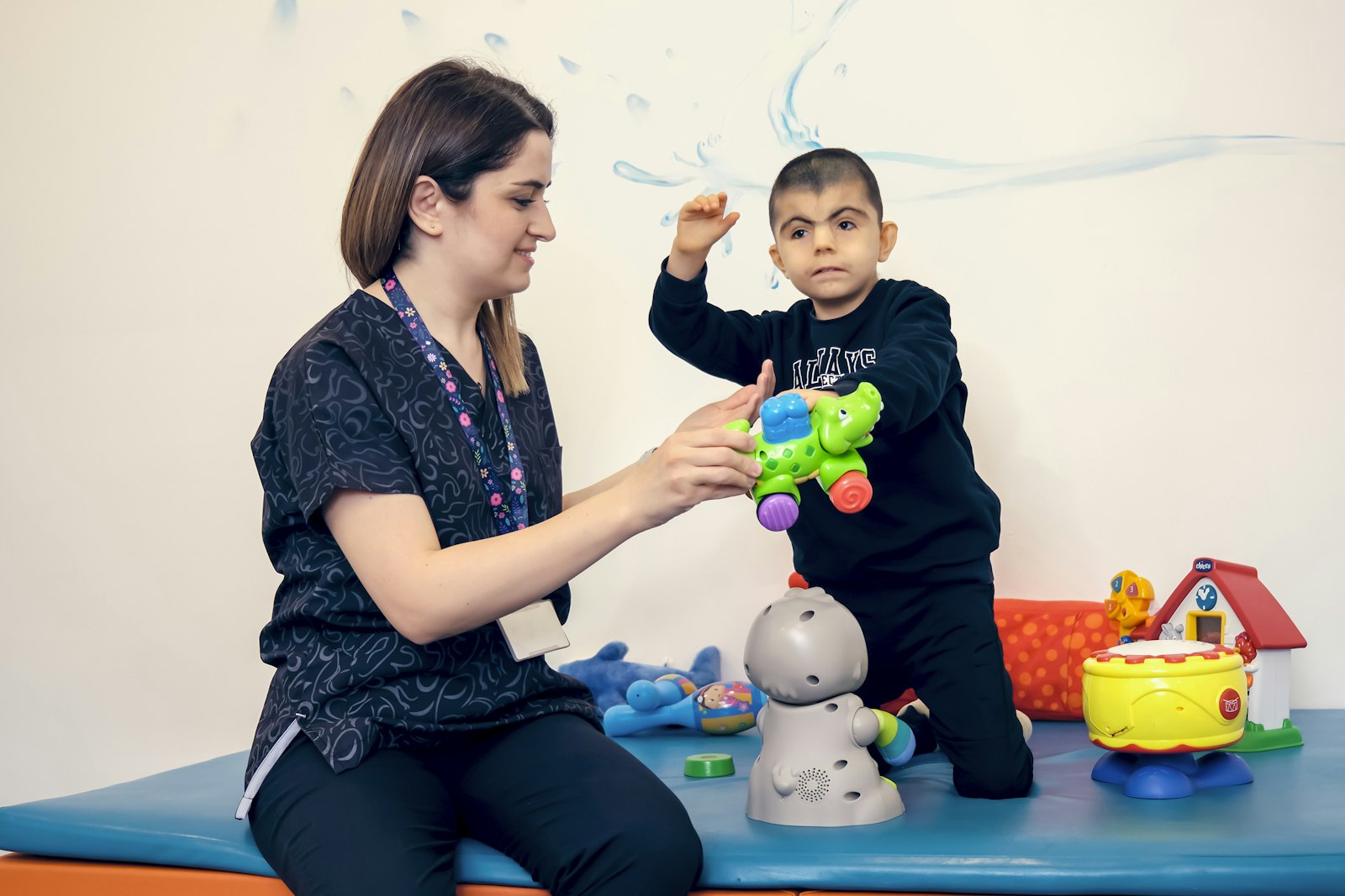 Pediatric occupational therapist working one-on-one with a child during an in-home session
